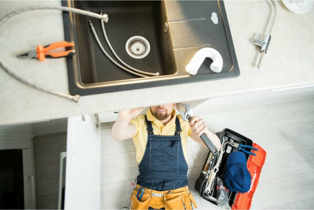 Plumber Repairing Pipe In Kitchen 2021 09 24 03 51 32 Utc Jpg